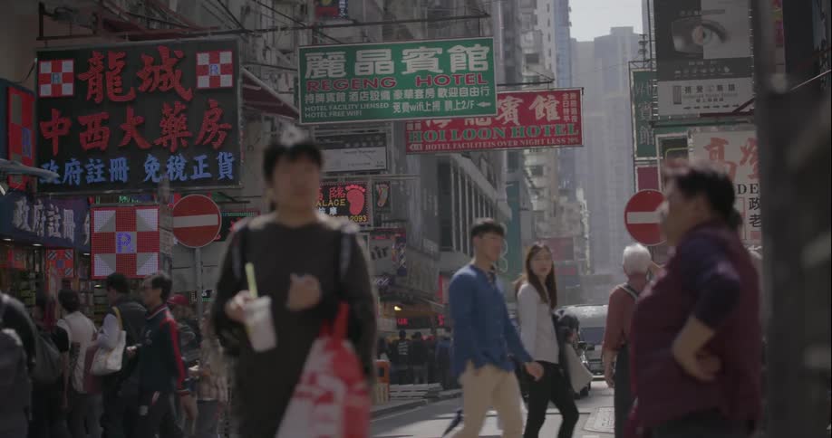 Crowds of people walking on street in foreign city