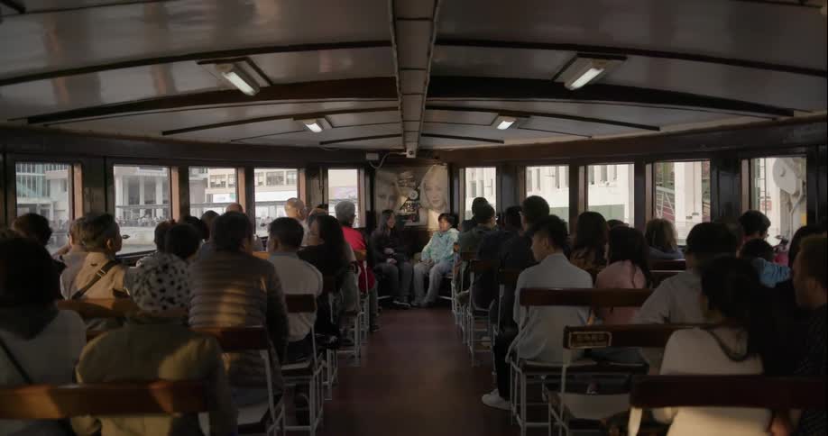 A boat is full of people as it travels