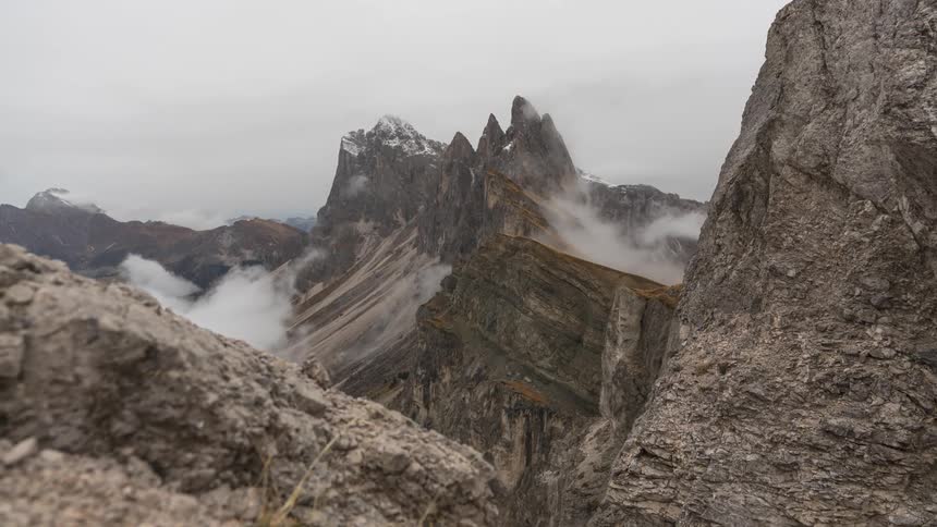 Landscape with mountains and ruins with mist on a cloudy day
