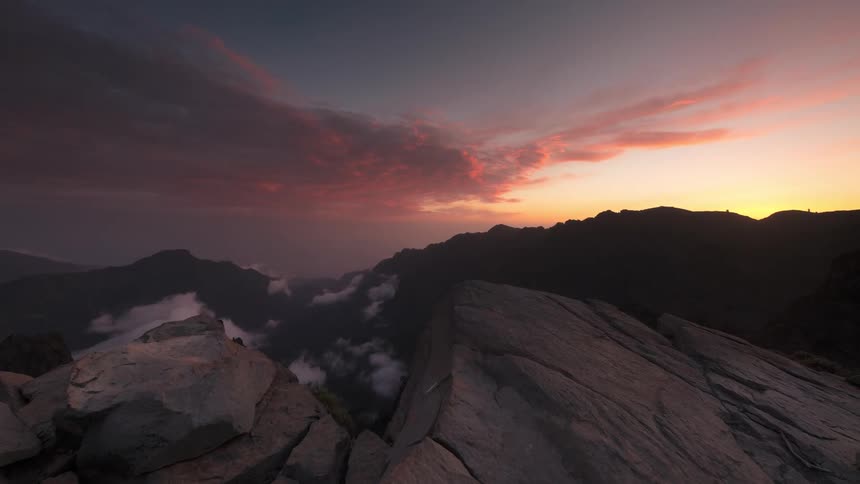 Mountainous landscape with low clouds and cloudy sky like dusk sky