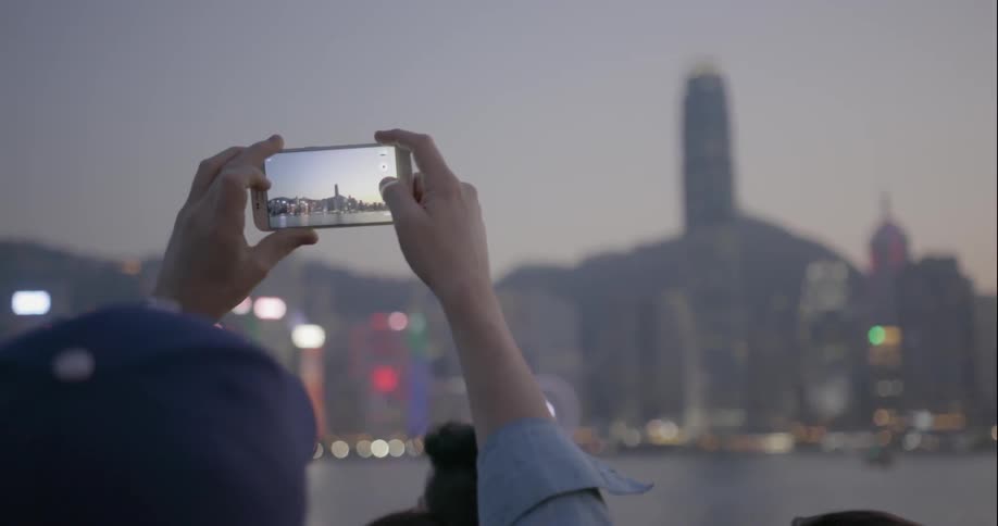 A man takes a picture with his smartphone