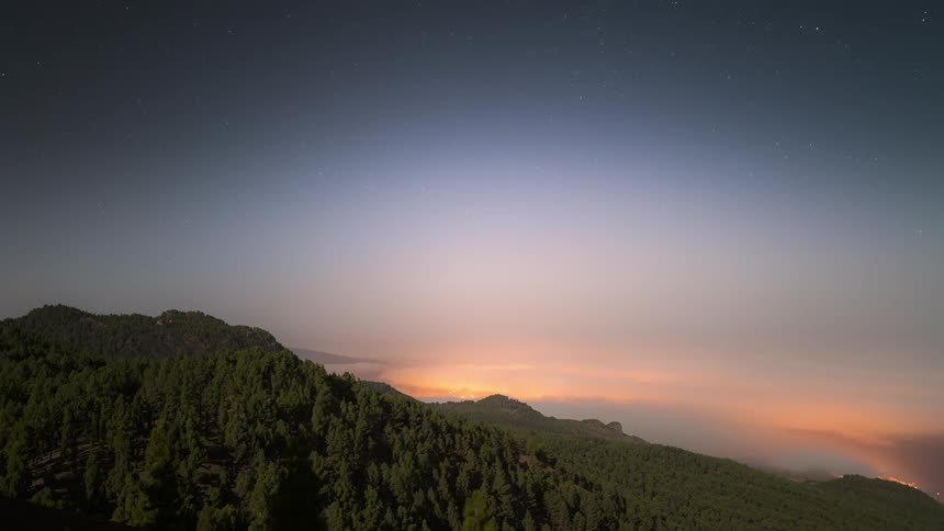 Day dusk and dawn with sea of low clouds passing alongside mountains