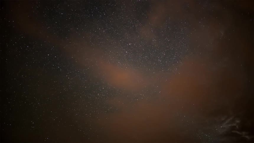 Outer space and clouds quickly gives way to a mountain range and landscape