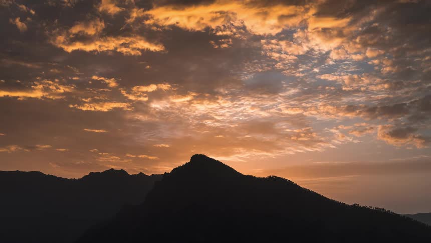 Silhouette of mountains on a cloudy day dawning