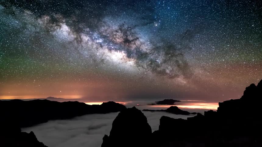 Time lapse of the milky way moving over the mountains at night