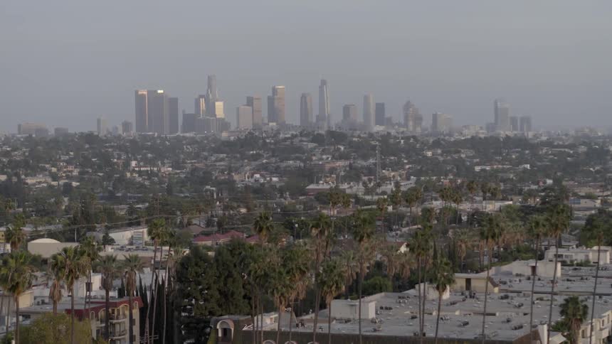 Aerial view of a large city moving towards the downtown area