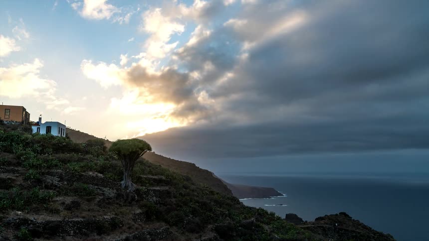 Time lapse of clouds rolling over the mountains in the coast