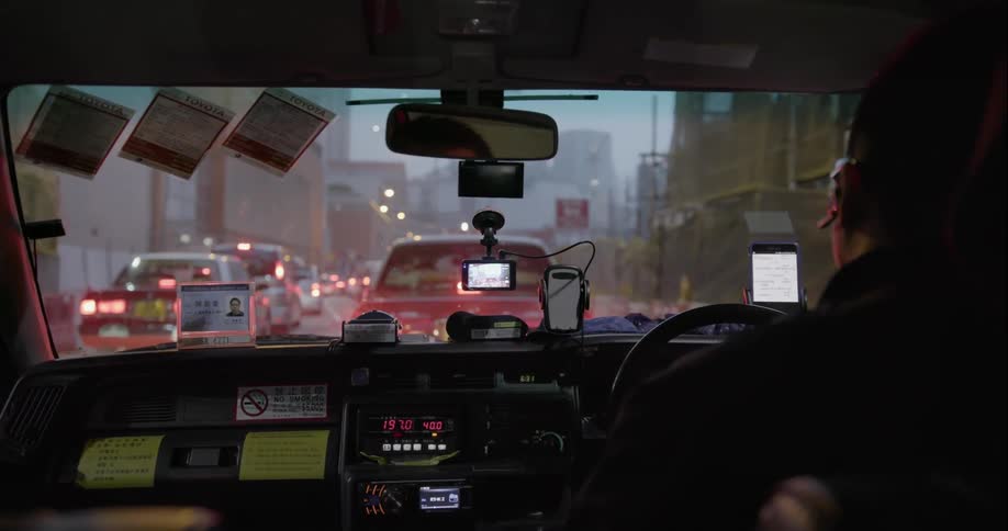 Traffic jam as seen from the backseat of a taxicab