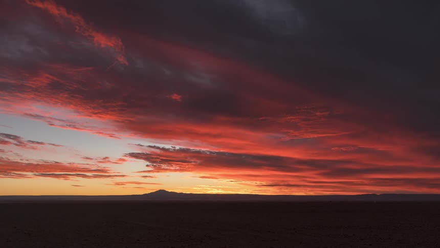 Landscape of dense clouds with the sun setting on the horizon
