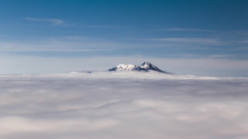 The mountain is taller than the clouds