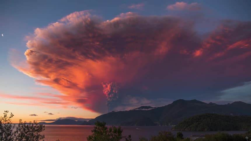 Seaside mountains landscape with swirling dense clouds with storm