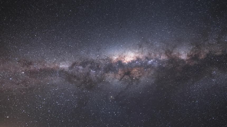 Sky with the dawn of the milky way on a rocky terrain