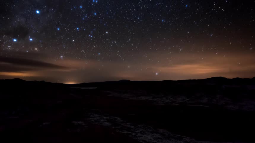 The milky way shines over the horizon