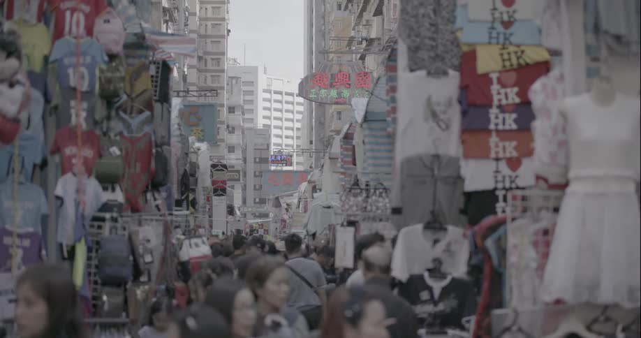 Crowds of people walking through market in hong kong