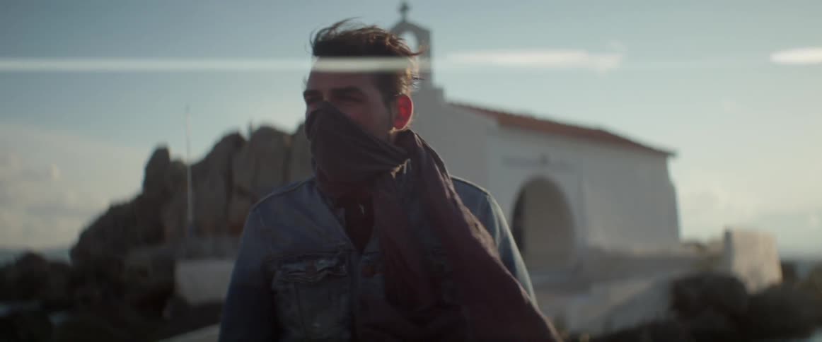A person wearing a scarf over their mouth