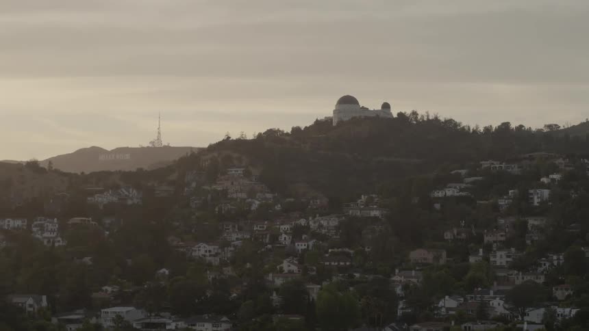 A town is on a hillside on a cloudy day