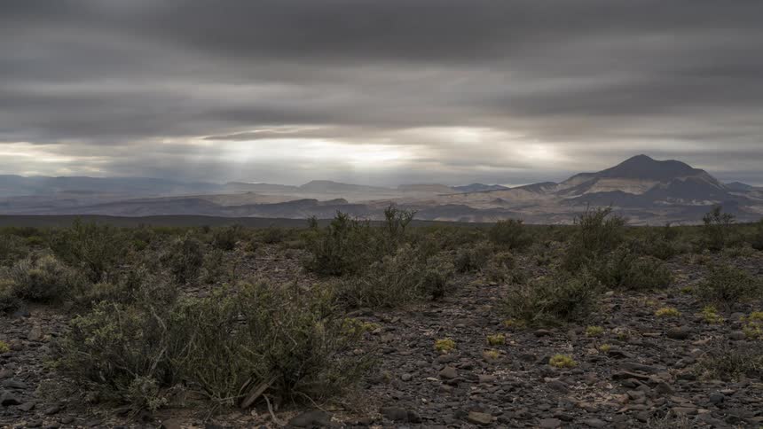 Clouds moving fast in the sky above the landscape