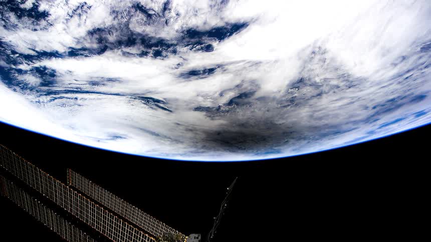 Space station solar panels rotate as the station orbits the daylight side of the earth