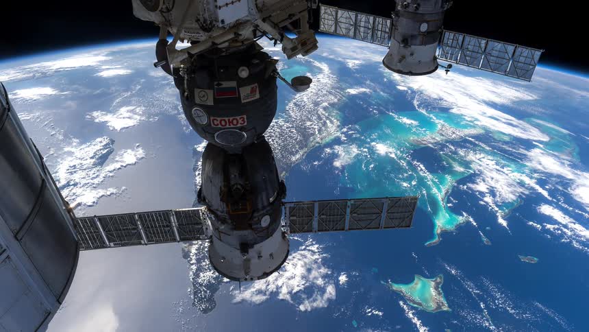 Satellite hovering over the rotating earth