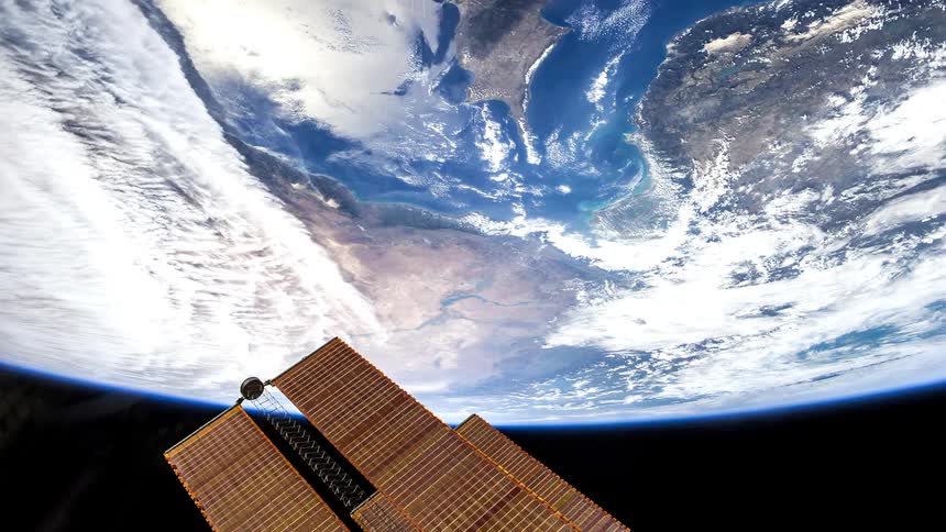 Solar panels of the international space station over the earth