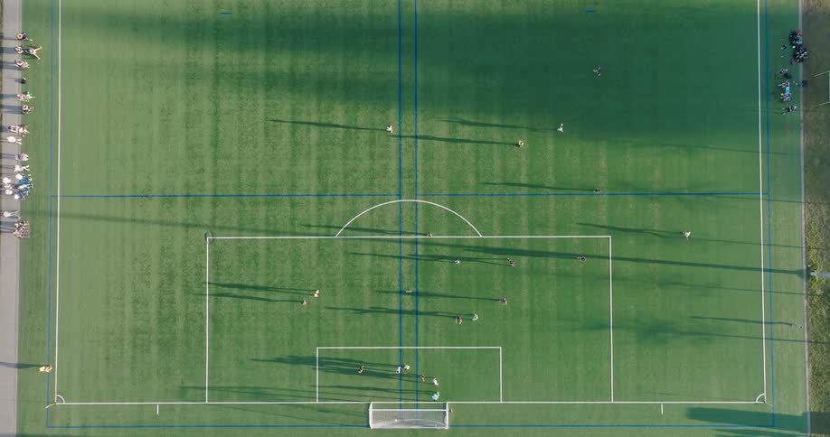 A player scores a goal during a soccer league tournament game