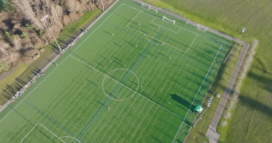 Adult rec league teams playing a soccer match on a regulation sized field