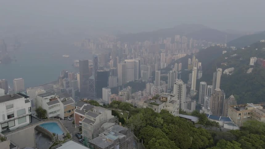 Below the city is covered with fog