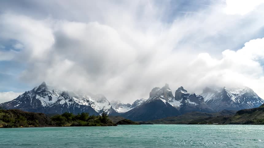 Time lapse of a body of water near a mountain range
