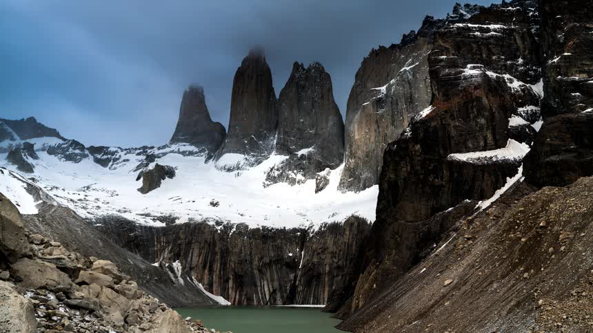 A small body of water is on the mountain