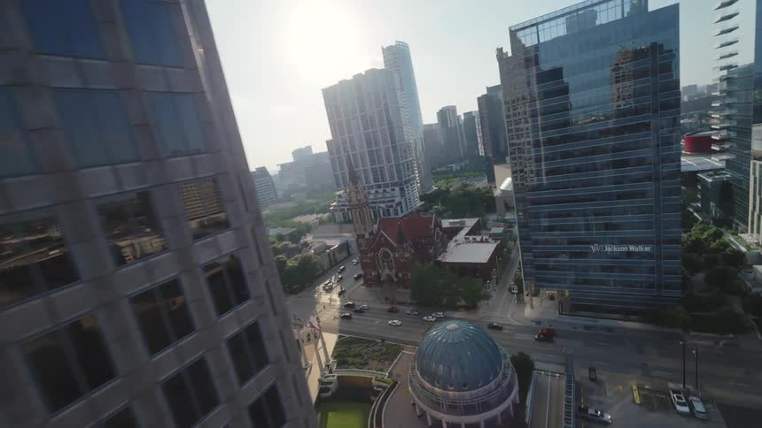 Flying through the skyscrapers and scenic skyline of downtown Dallas