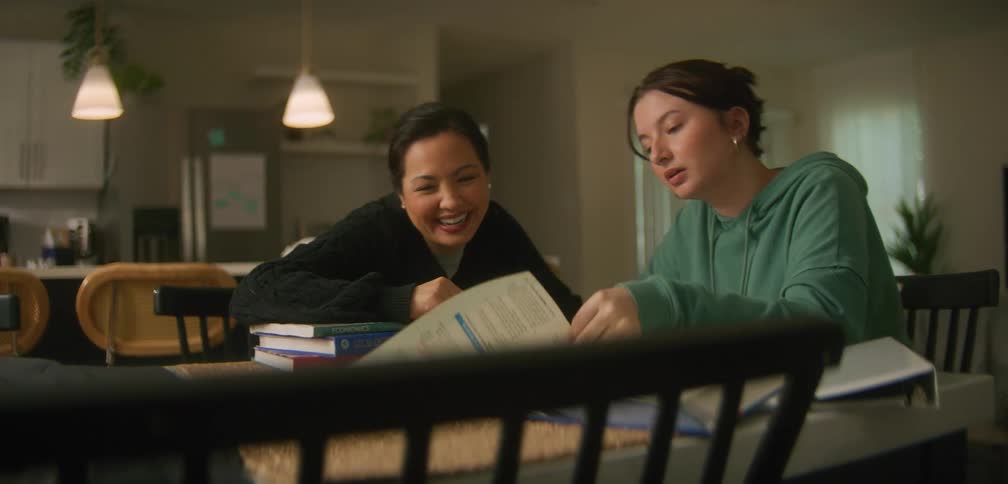 Two women are talking and studying