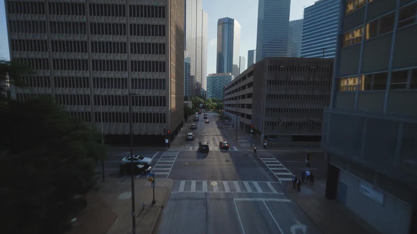 Scenery of a metropolis with large buildings and streets busy with vehicle traffic