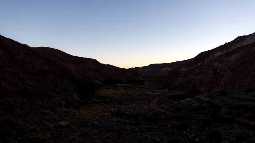 Mountainous landscape with the sky dawning on the stars appearing