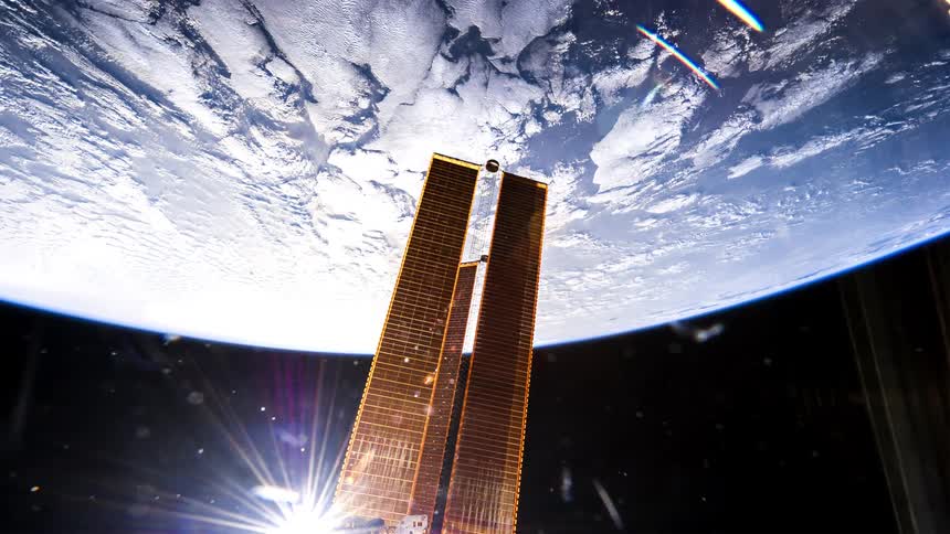 The sun reflects off the satellite in space