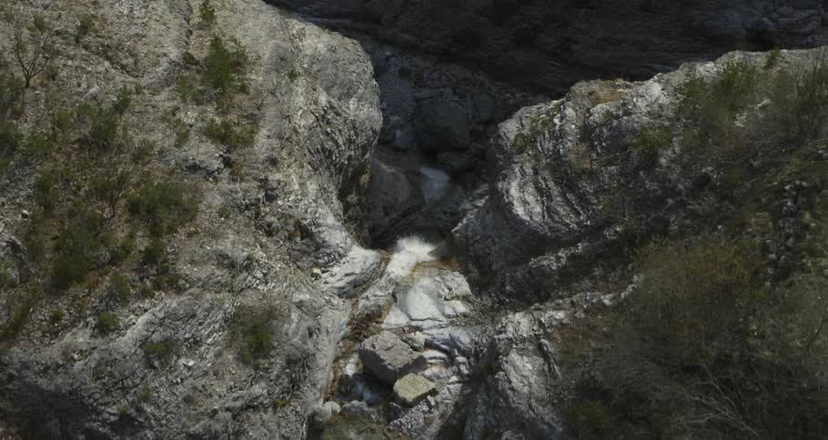 A stream of water is flowing down the mountain