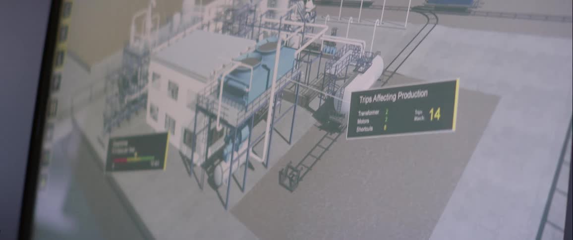 A human hand passing its finger across the screen where there is a construction project with various information on the screen