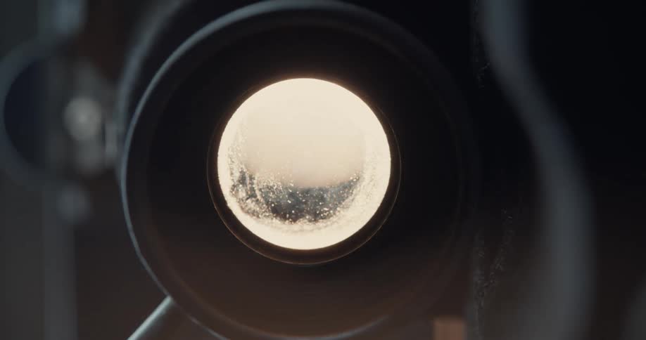 A camera is pointed forward and the lens is bright