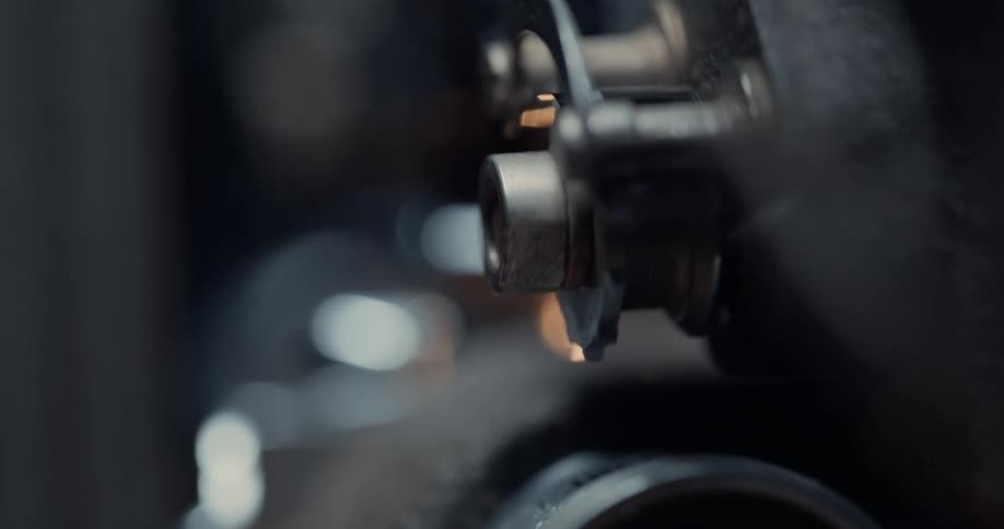Close up of the gears of a vintage film projector spinning