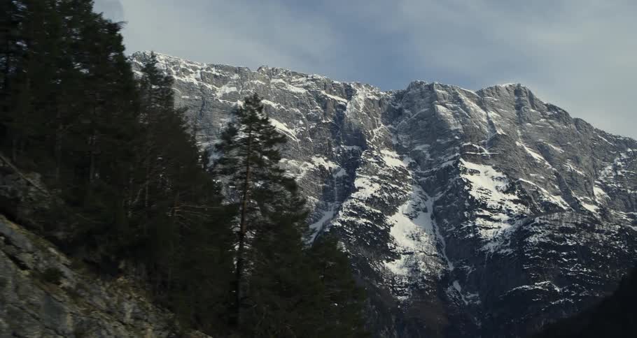 Aerial panorama of rocky mountains with conifers