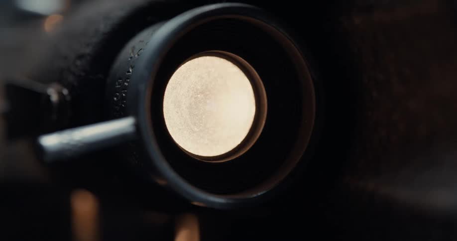 The lens on a photography camera is flashing