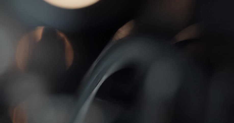Metal wheel turns with lights behind it