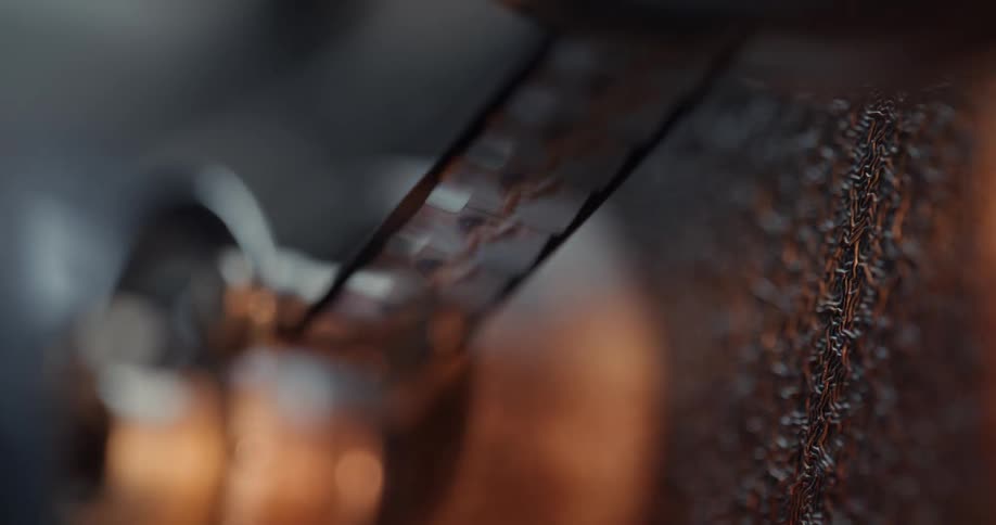 Close up of film passing through the gears of a vintage projector