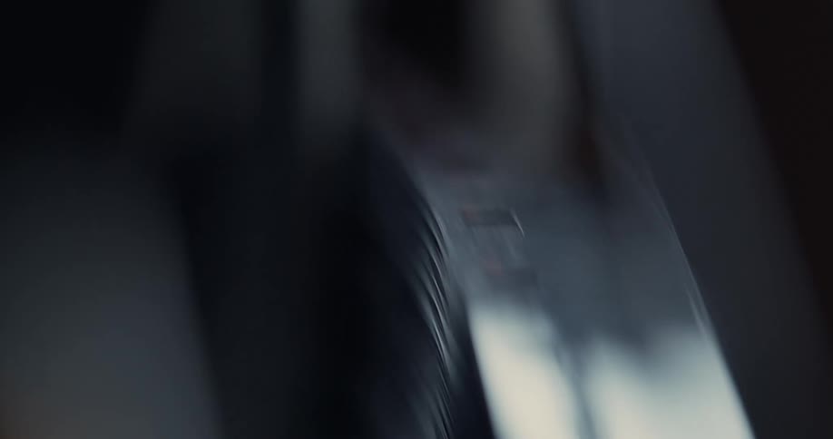 Smooth strips of metal run through a spinning machine