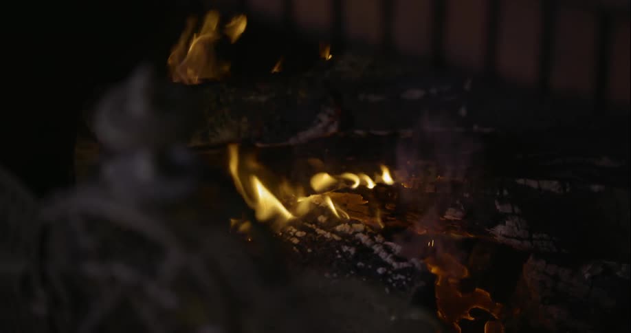 Close up of a small campfire burning at night
