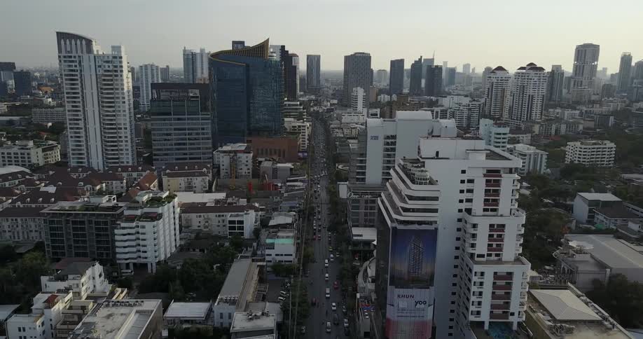 A city with tall buildings and traffic