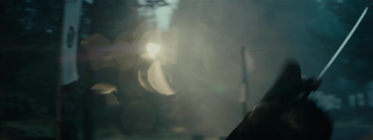 A person in black clothing is falling and holding a long sword