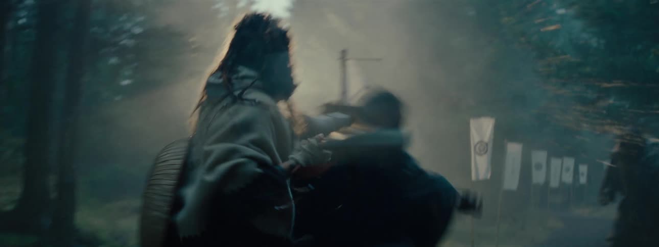 A person fighting another using a spear and knocking him to the ground