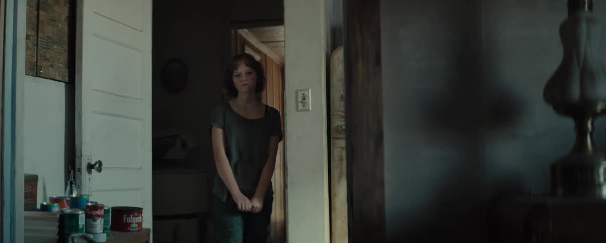 Young woman hesitates while walking into the room