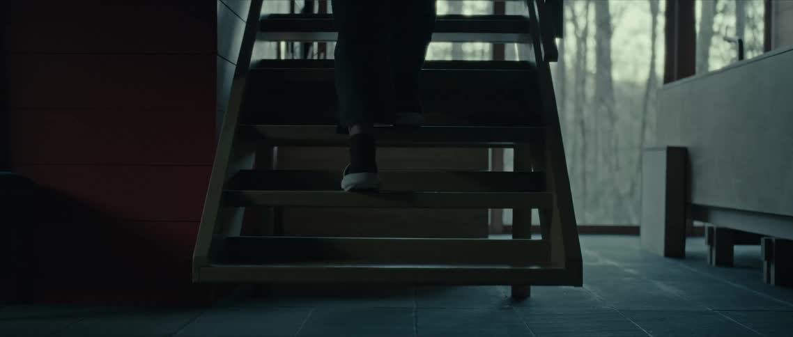 A person steps up a staircase