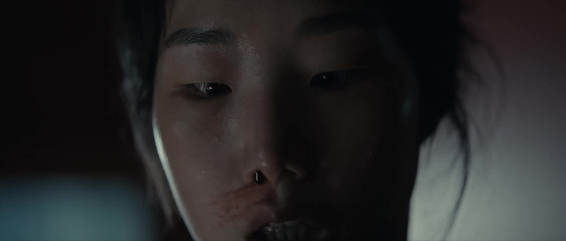 Portrait of a young woman with a bloody nose